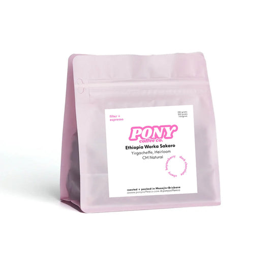 Pink coffee bag with a label on a white background