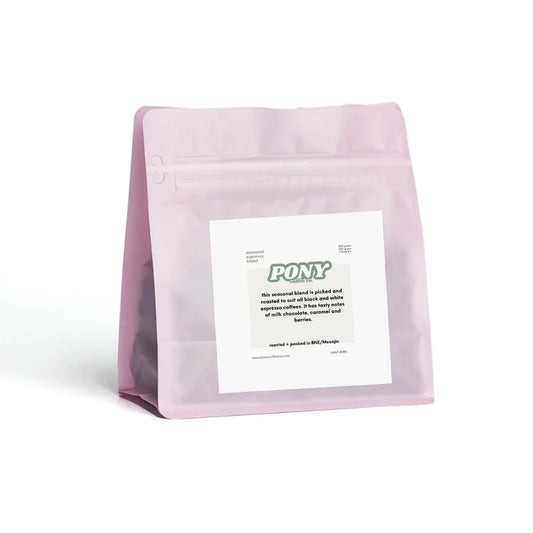 Pink coffee bag with a label on a white background, coffee espresso blend