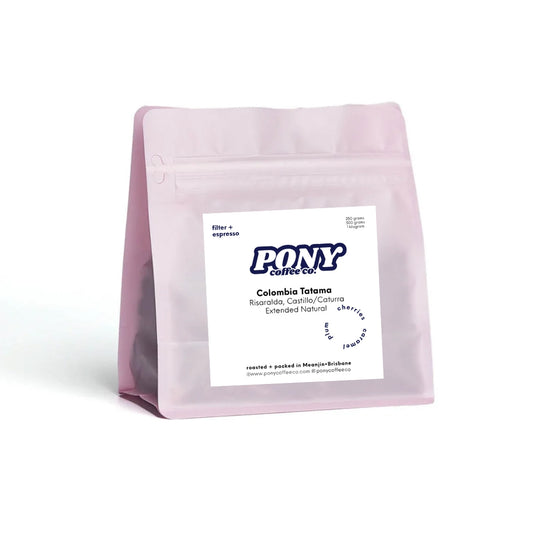 Pink coffee bag with Pony Coffee Co. label on a white background